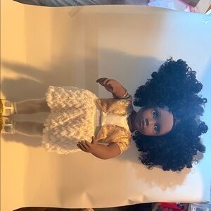 Charming Gold and White Doll with Curly Hair